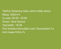 Telefon dükanina satici xanim